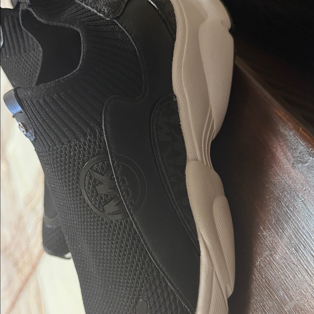 Brand new Michael Kors Black and Cream Slip-On Sneakers